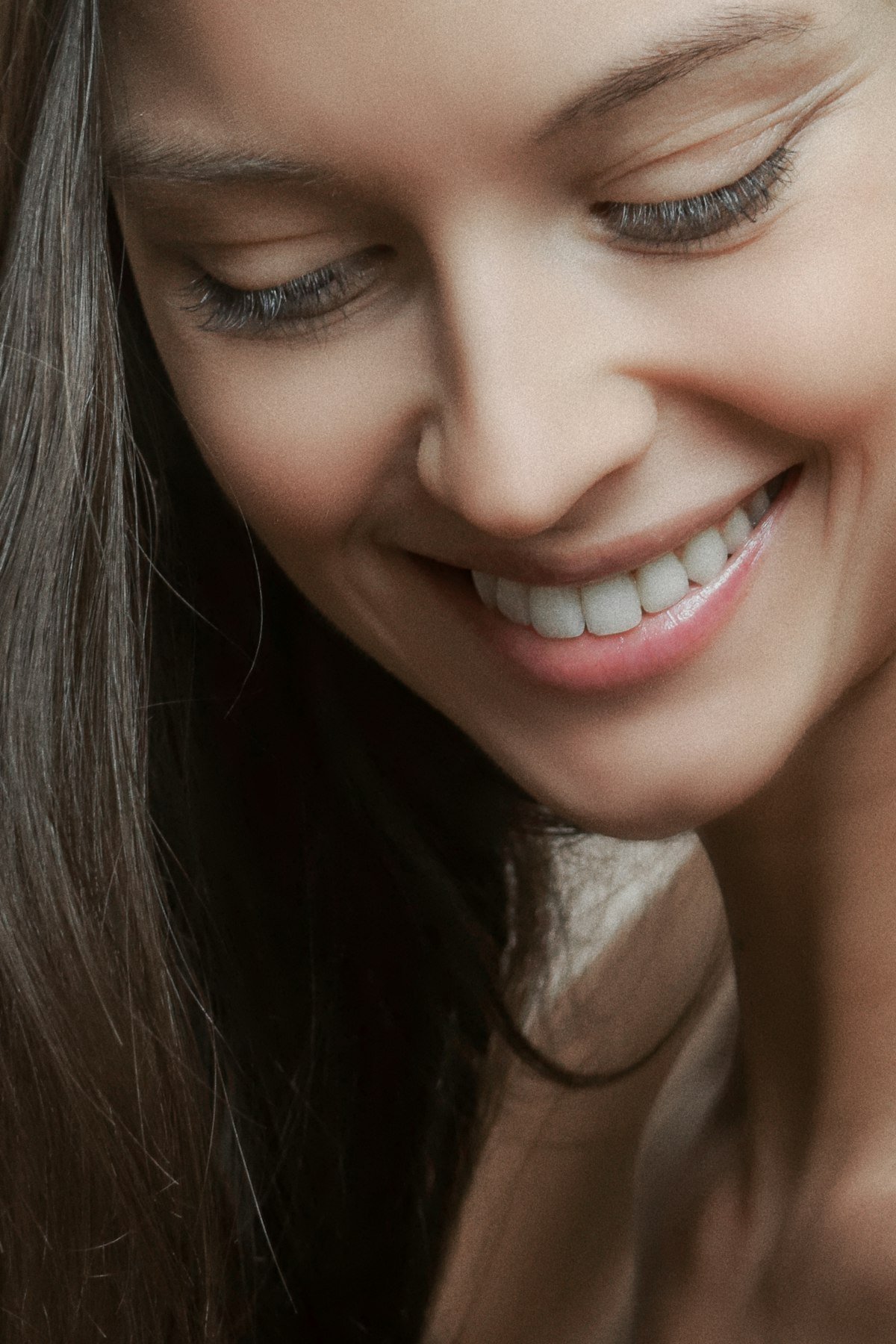 A woman with a bright, confident smile